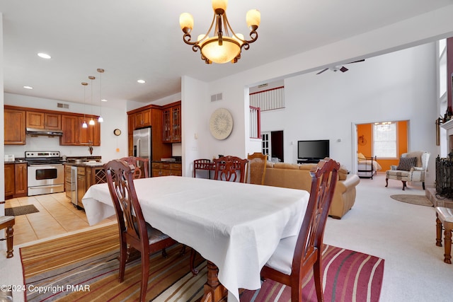 dining space with light tile patterned flooring, visible vents, a notable chandelier, and recessed lighting