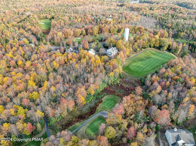 drone / aerial view featuring a forest view