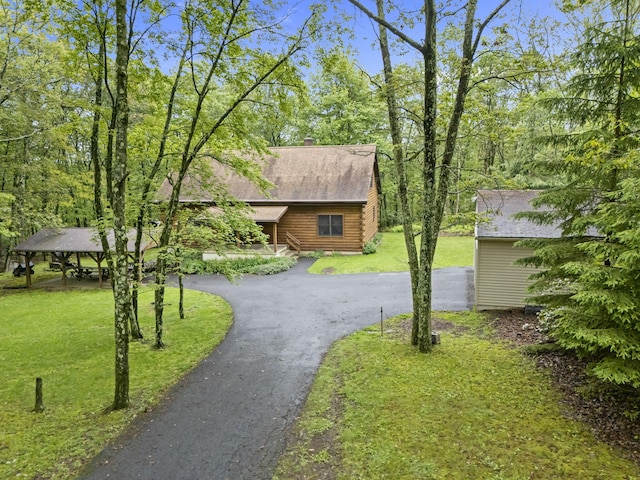 324 Hatchery Rd, Jim Thorpe, PA 18229 - view of front of house with driveway, a front yard, a chimney, and roof with shingles