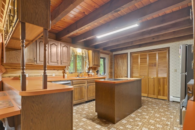 324 Hatchery Rd, Jim Thorpe, PA 18229 - kitchen featuring a wood ceiling with exposed beams, light countertops, a kitchen island, a peninsula, and freestanding refrigerator