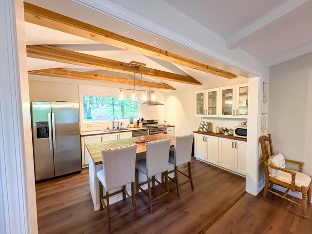 1085 Maple Lake Dr, Bushkill, PA 18324 - kitchen with stainless steel appliances, beamed ceiling, white cabinets, glass insert cabinets, and a sink