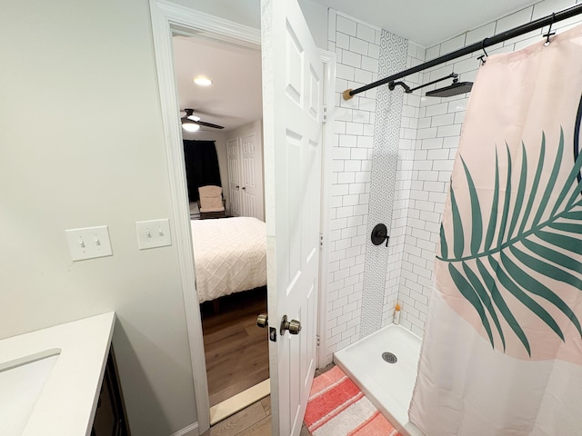 1085 Maple Lake Dr, Bushkill, PA 18324 - bathroom featuring a stall shower, connected bathroom, vanity, wood finished floors, and ceiling fan