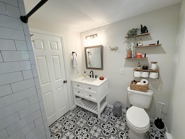 1085 Maple Lake Dr, Bushkill, PA 18324 - bathroom with toilet, vanity, baseboards, and tile patterned floors