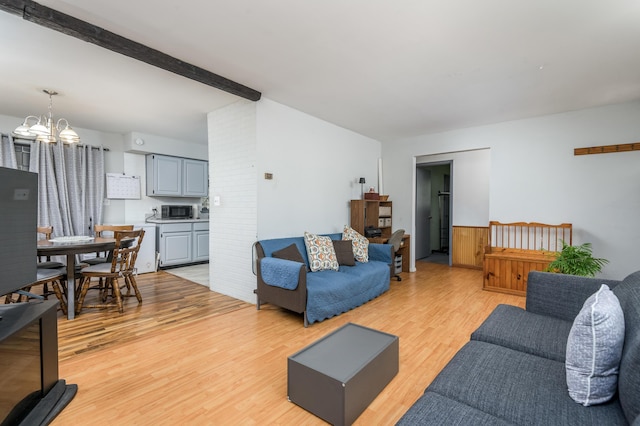 1259 Winding Way, Tobyhanna, PA 18466 - living room with light wood-style floors, a chandelier, and beamed ceiling