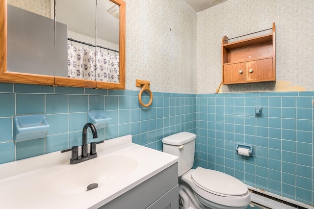 1259 Winding Way, Tobyhanna, PA 18466 - bathroom featuring wallpapered walls, baseboard heating, tile walls, toilet, and wainscoting