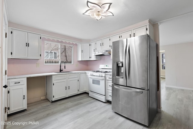 kitchen featuring stainless steel fridge with ice dispenser, light wood-style flooring, white gas stove, under cabinet range hood, and a sink