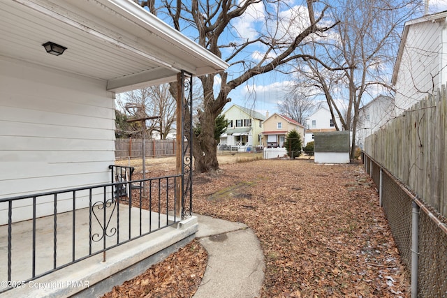 view of yard featuring a residential view and fence