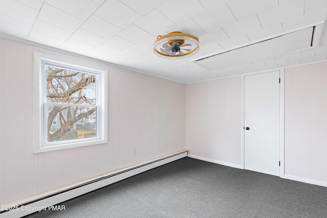 carpeted spare room with a baseboard radiator