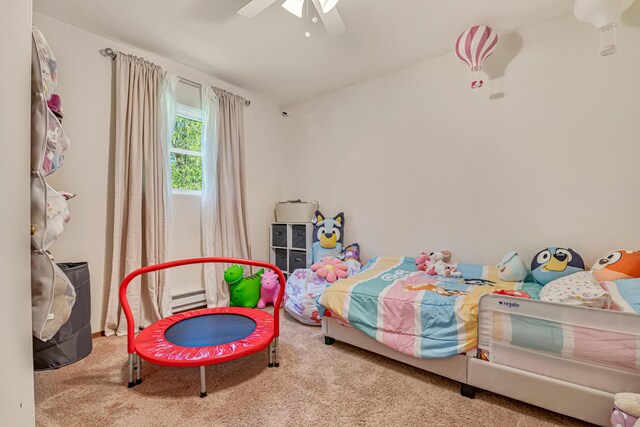 217 Coach Rd, Tobyhanna, PA 18466 - carpeted bedroom with a baseboard heating unit and a ceiling fan