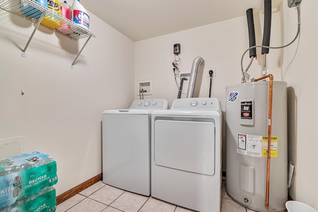 217 Coach Rd, Tobyhanna, PA 18466 - washroom with water heater, independent washer and dryer, light tile patterned floors, and baseboards