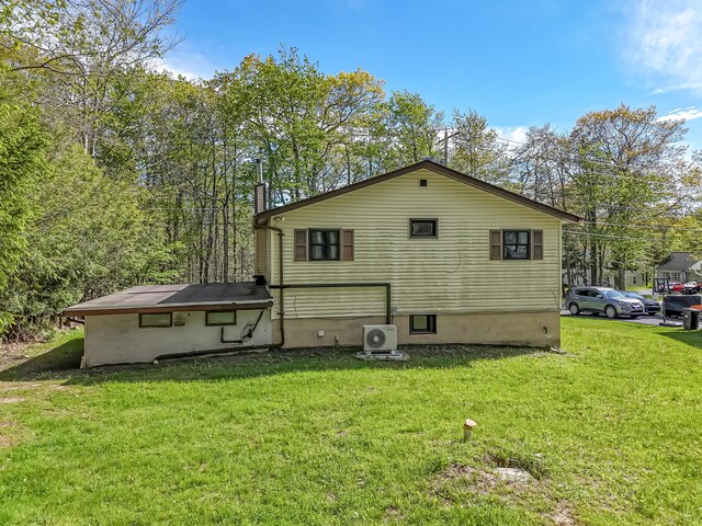 217 Coach Rd, Tobyhanna, PA 18466 - rear view of house featuring a cooling unit and a lawn