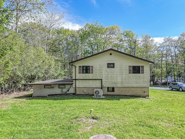 217 Coach Rd, Tobyhanna, PA 18466 - rear view of house featuring a cooling unit and a yard