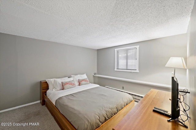 carpeted bedroom with baseboards, baseboard heating, and a textured ceiling