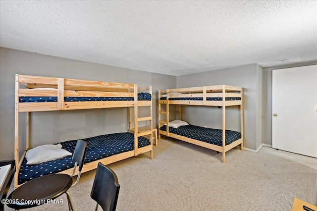 carpeted bedroom featuring a textured ceiling