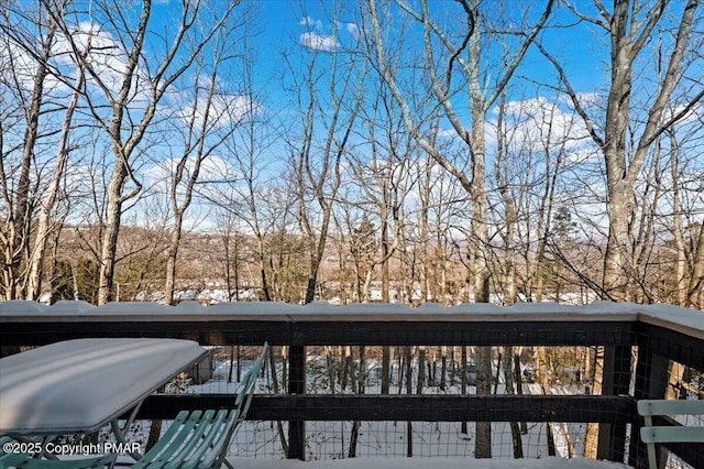 view of snow covered deck