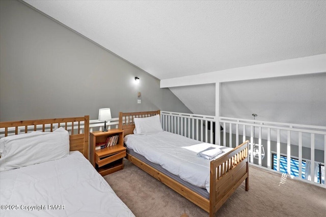 carpeted bedroom featuring lofted ceiling