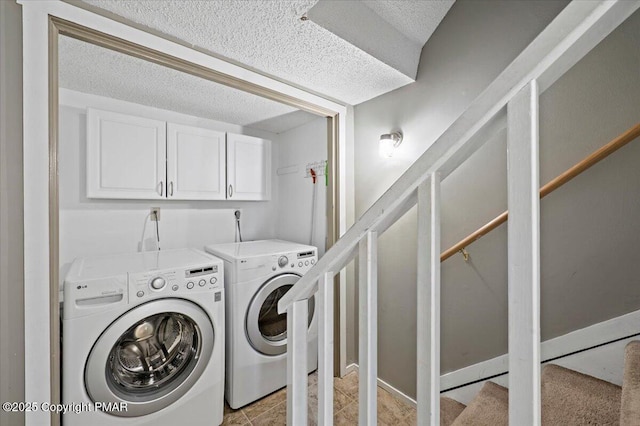 laundry room featuring independent washer and dryer and cabinet space