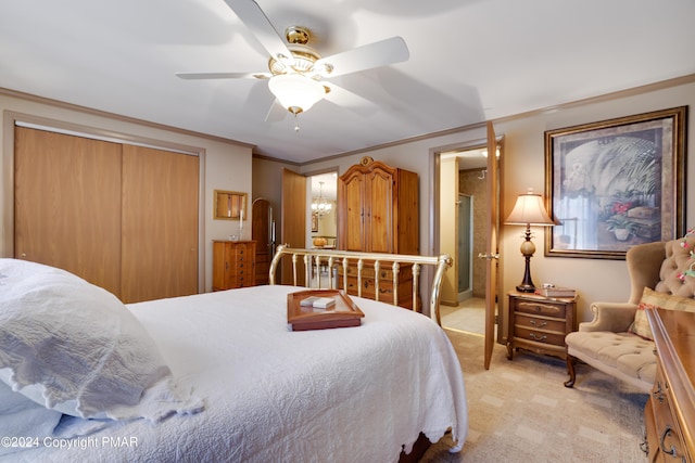 bedroom with light carpet, ceiling fan, ornamental molding, and a closet