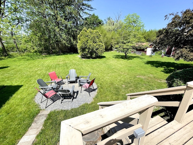 245 Learn Rd, Tannersville, PA 18372 - view of grassy yard featuring an outdoor fire pit and a patio area