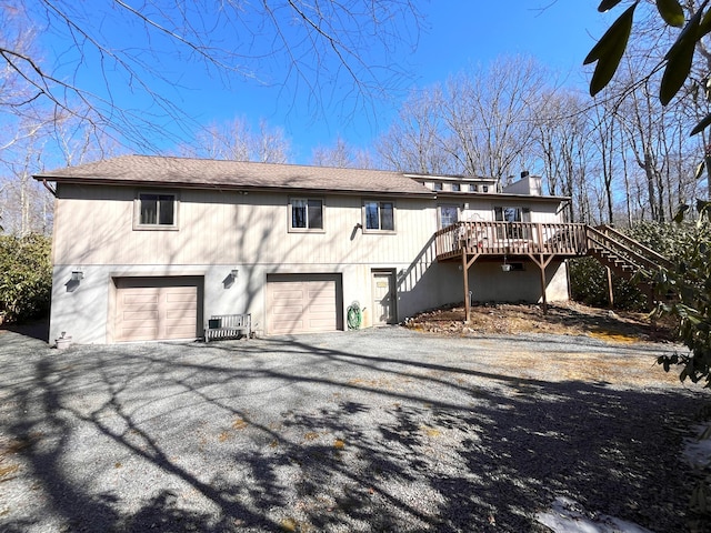 5 Cayuga Dr, Jim Thorpe, PA 18229 - view of front of house with a garage, stairs, driveway, and a chimney