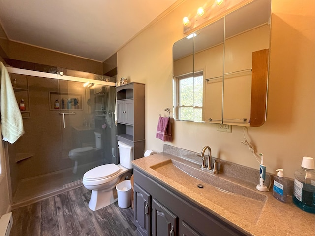 5 Cayuga Dr, Jim Thorpe, PA 18229 - bathroom featuring toilet, a stall shower, wood finished floors, and a baseboard heating unit