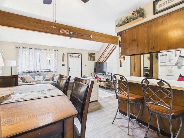 179 Choctaw Dr, Pocono Lake, PA 18347 - dining area with beamed ceiling, a ceiling fan, and light wood-style floors