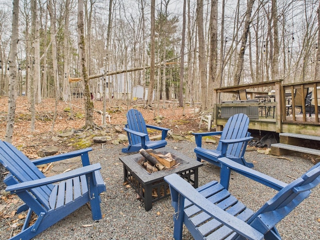 179 Choctaw Dr, Pocono Lake, PA 18347 - view of yard with a wooden deck and an outdoor fire pit