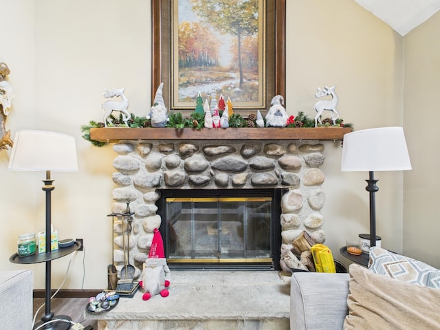 179 Choctaw Dr, Pocono Lake, PA 18347 - details featuring a stone fireplace, wood finished floors, and baseboards