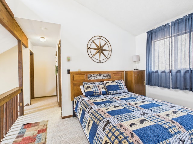 179 Choctaw Dr, Pocono Lake, PA 18347 - bedroom featuring light colored carpet and lofted ceiling