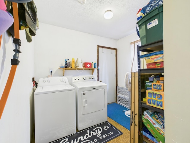 179 Choctaw Dr, Pocono Lake, PA 18347 - laundry room with washing machine and clothes dryer, laundry area, and a textured ceiling