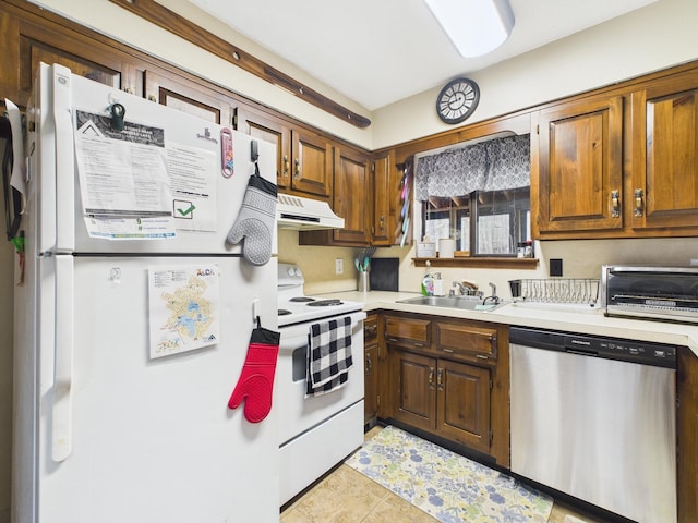 179 Choctaw Dr, Pocono Lake, PA 18347 - kitchen featuring white appliances, under cabinet range hood, light countertops, a sink, and a toaster