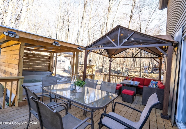 wooden terrace with an outdoor living space and outdoor dining space