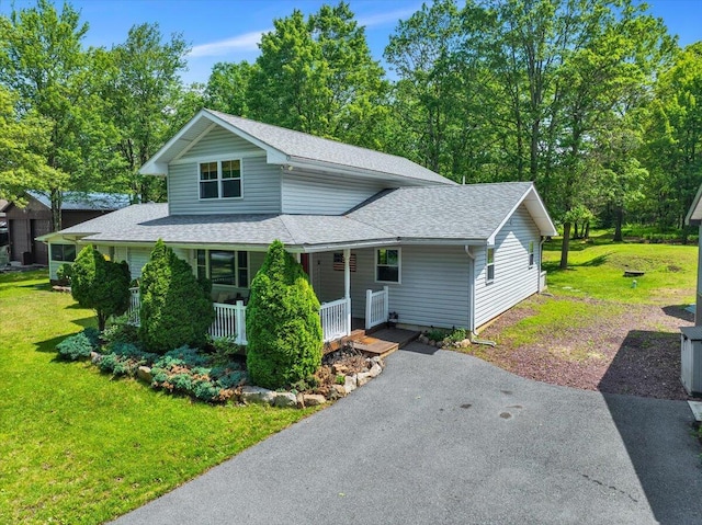 84 Deer View Dr, Jim Thorpe, PA 18229 - view of front of home featuring roof with shingles, covered porch, a front yard, and asphalt driveway