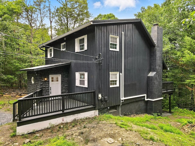 16 Norman Dr, East Stroudsburg, PA 18302 - view of front of home featuring a wooden deck and a chimney