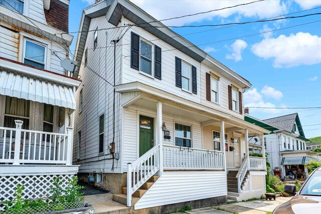 12 W 6th St, Jim Thorpe, PA 18229 - townhome / multi-family property featuring covered porch and stairway