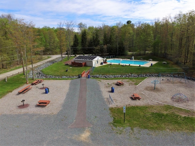 view of community featuring a wooded view
