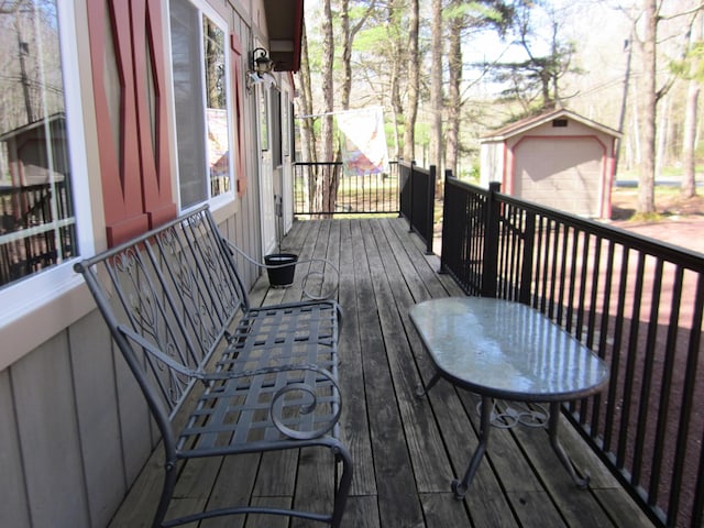 deck featuring an outdoor structure
