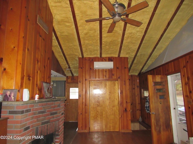 interior space featuring wooden walls, vaulted ceiling, an AC wall unit, and wood finished floors