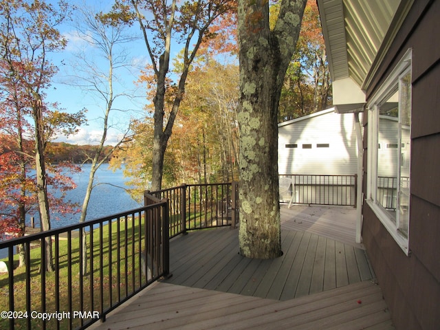 wooden deck featuring a water view