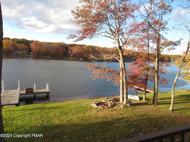 dock area featuring a water view and a yard