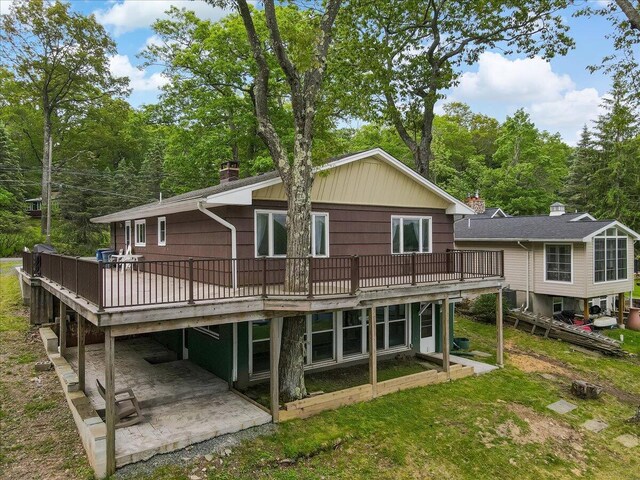 300 Indian Lake Trl, White Haven, PA 18661 - rear view of house with a deck, a patio, and a chimney