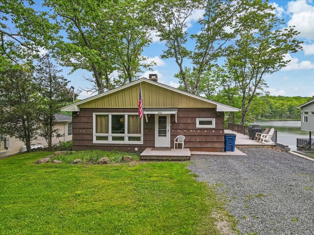 300 Indian Lake Trl, White Haven, PA 18661 - view of front of house featuring a deck, a front lawn, and a chimney