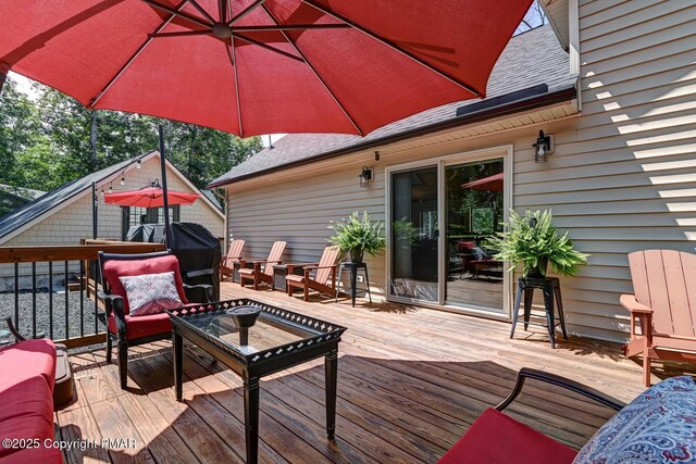 wooden deck with an outdoor hangout area