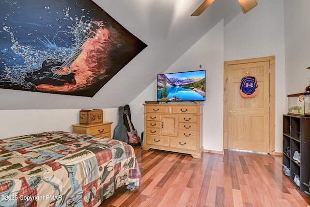 bedroom featuring lofted ceiling, hardwood / wood-style flooring, and ceiling fan