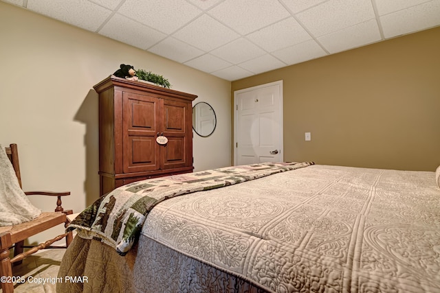 bedroom featuring a drop ceiling