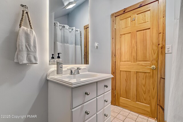 bathroom with vanity, tile patterned floors, and a shower with curtain