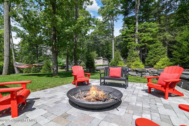 view of patio / terrace with a fire pit