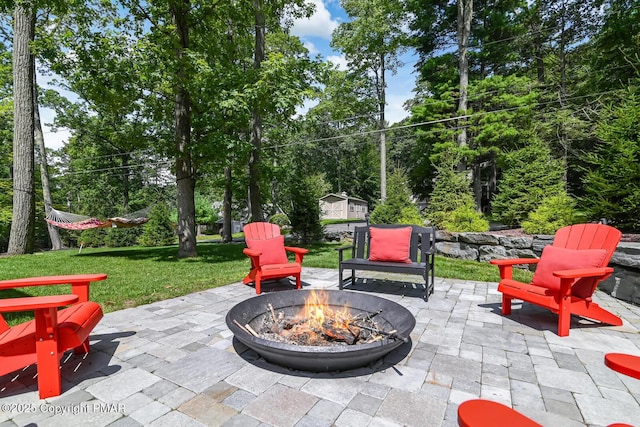 view of patio featuring an outdoor fire pit