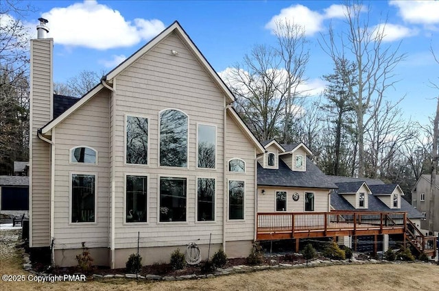 back of house with a wooden deck