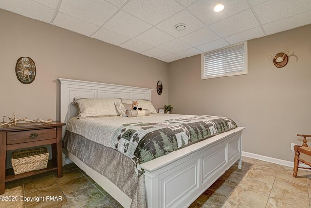 bedroom with a paneled ceiling